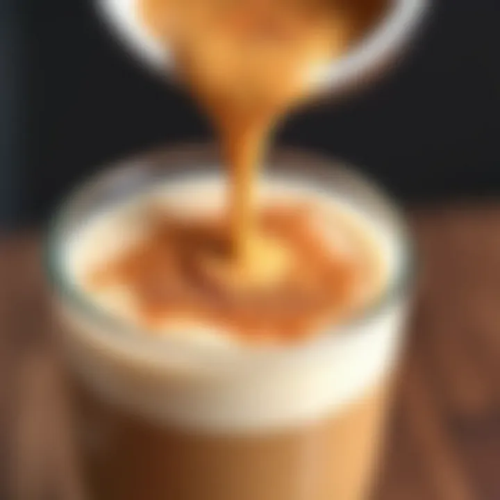 A close-up view of brown sugar being added to oat milk with espresso in the background