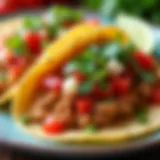 A vibrant plate of ground chicken tacos topped with fresh vegetables and salsa