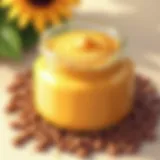 A jar of creamy homemade sun butter surrounded by sunflower seeds