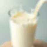 A close-up view of a glass of whole milk with cream separation.